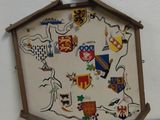 a clock that is sitting on top of a wooden table