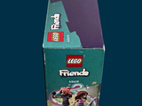 a box of lego friends figures sitting on a table