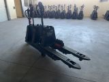 a picture of a fork lift truck in a garage