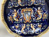 a blue and gold plate with a design on it