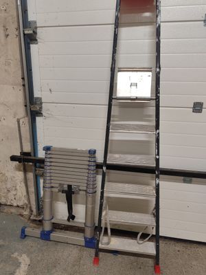 a ladder that is leaning against a garage door