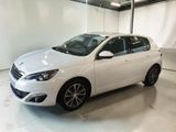a white car parked in a garage with a white floor