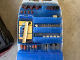 an image of a tool kit sitting on the floor next to a laptop