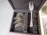silverware in a case with forks and spoons in it