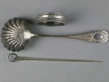 two spoons and a pair of scissors on a table