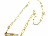 a close up of a gold chain with a diamond bar on it