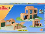 a box with a picture of a wooden building set