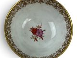 bowl with gold rim and floral decoration on the rim