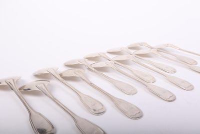 a lot of spoons that are sitting on a table