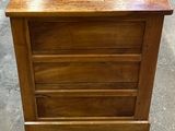 an image of a wooden chest of drawers in a store