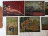 many paintings on the wall of a room