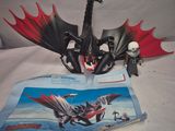 a book with a picture of a dragon on it and a book with a picture of a dragon on it