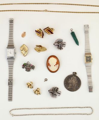many different types of jewelry on a white surface