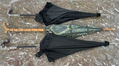 two umbrellas laying on the ground next to each other