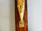 a gold statue of jesus on a wooden cross
