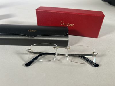 the glasses are next to a red box on the table