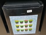 a picture of a fridge with a picture of cupcakes on it