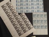 two sheets of paper with stamps on them sitting on top of a table