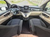 the interior of a small car with two seats and a steering wheel