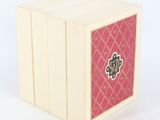 a white box with pink and gold designs on it