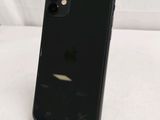 an iphone is sitting on top of a stand on a bed