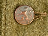 a picture of a button with a picture of a lion on it