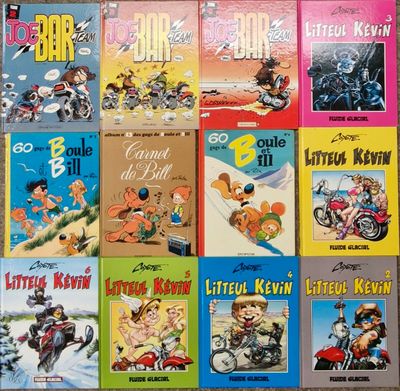 many children ' s books are lined up on a table