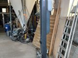 several pieces of wood are stacked up in a warehouse