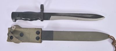 two knives that are sitting next to each other on a table