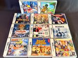 a lot of nintendo wii games on the table