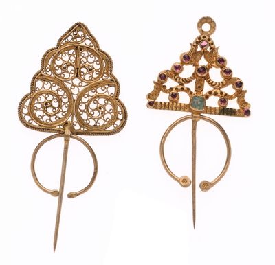 pair of gold and garnett brooches with purple stones