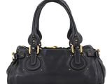 a black handbag on a white background