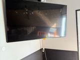 a flat screen tv mounted on the wall in a room