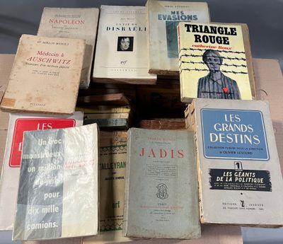 several books are stacked on top of each other on a table