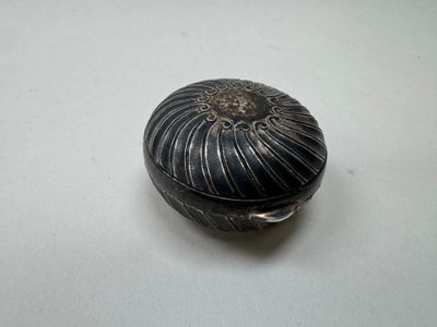 a black and silver box on a white table