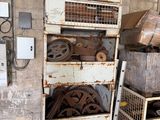 a metal shelf with a bunch of wheels on top of it