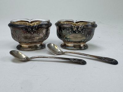 two spoons and a bowl sitting on a table
