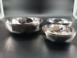 three bowls sitting on a table next to each other