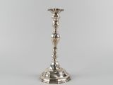 a silver plated candle holder on a white background