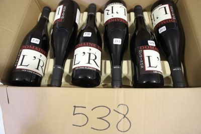 six bottles of wine are in a cardboard box with a price tag