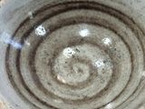 a close up of a bowl on a table