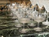 many wine glasses on a marble counter top
