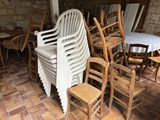 many chairs and tables in a room with a brick floor