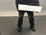 a man that is holding a sign in front of him