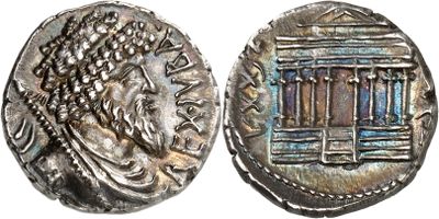 a silver coin with an image of a man on it