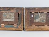 pair of old wooden picture frames with a picture of a man and a woman