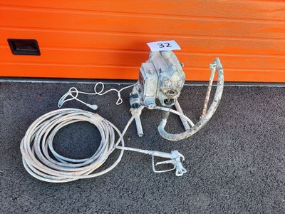 an orange garage door with a hose and a hose attached to it