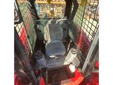 a picture of a small tractor with a seat in the back of it