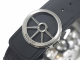a close up of a watch with a black strap