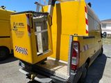 a yellow truck that is parked in the parking lot